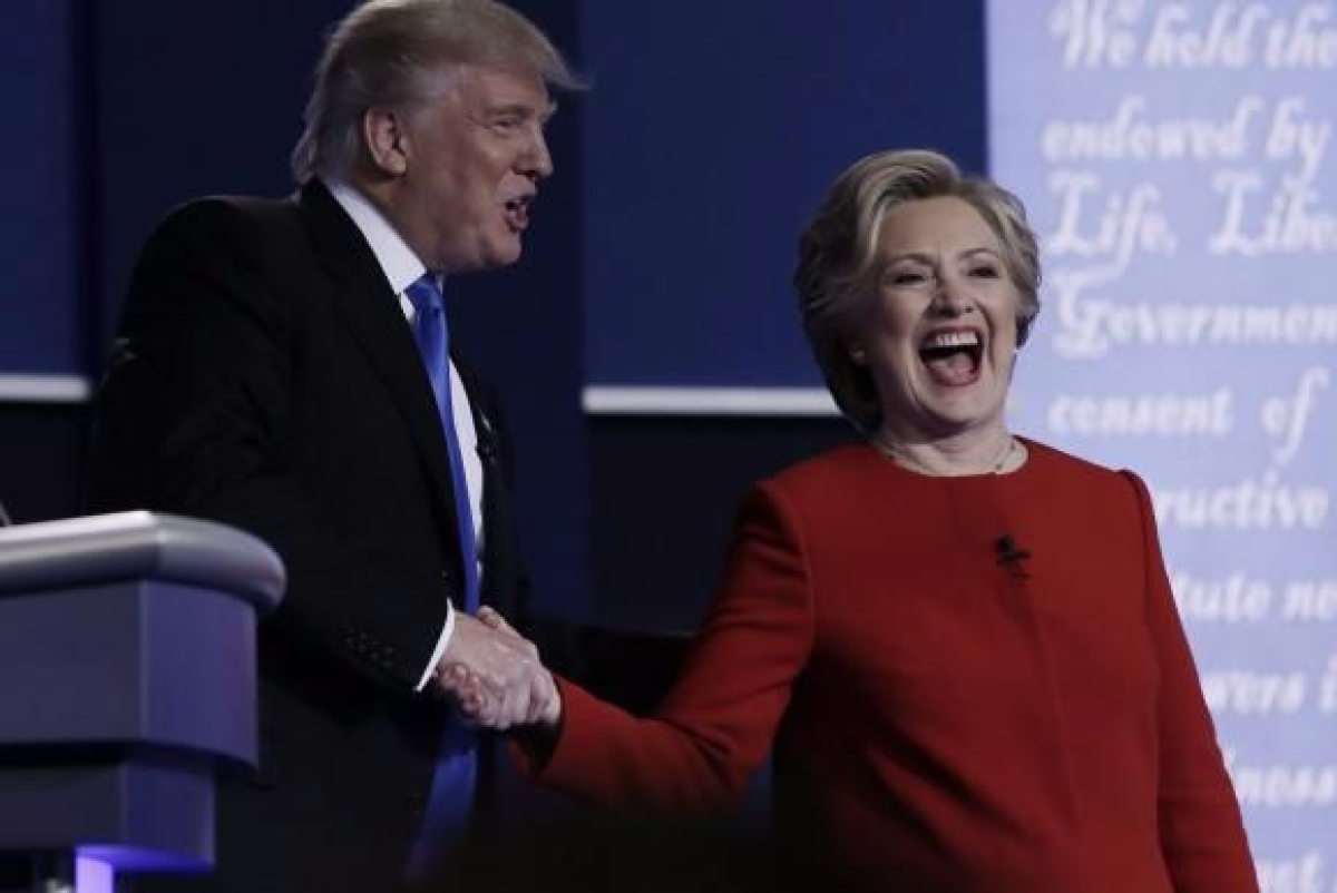 Os candidatos � presid�ncia norte-americana o republicano Donald Trump e democrata Hillary Clinton, em debate televisivo (Imagem: Rick Wilking/EPA/Ag�ncia Lusa)
